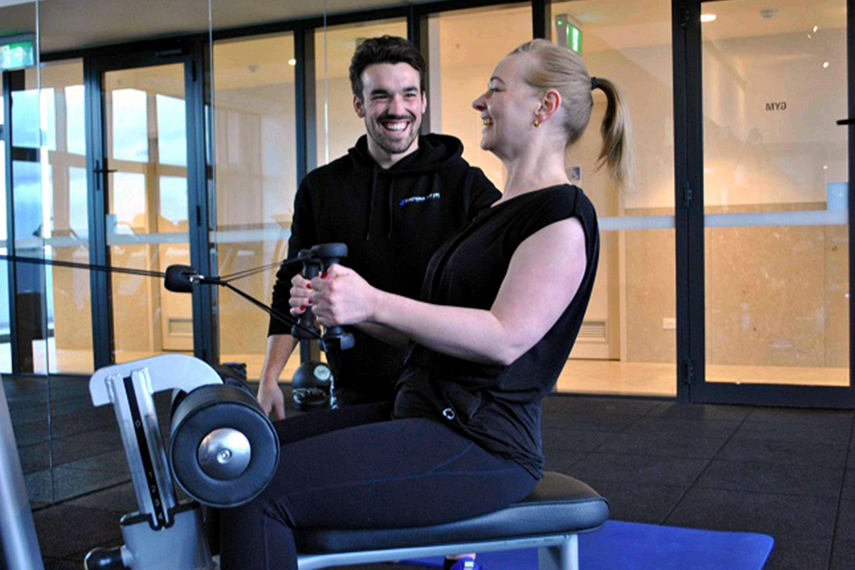 Seated rows in Apartment gym